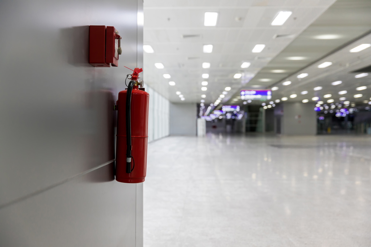 dry-chemical-powder-fire-extinguisher-in-corridor-2023-11-27-05-25-55-utc